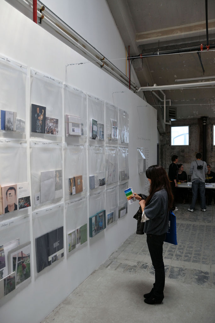 The 20 special editions specially for this photofestival, hanging on the wall in plastic bags
